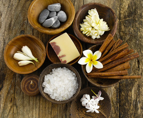 Fototapeta na wymiar Stones, soap, salt, cinnamon, frangipani flower