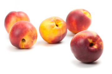 Ripe peaches fruits isolated on white