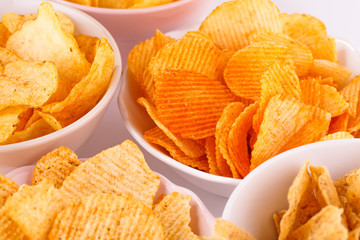 Potato and wheat chips in bowls