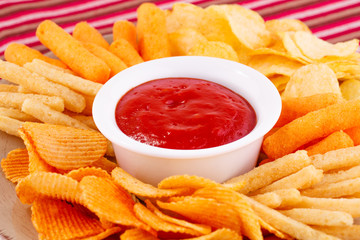 Potato, corn chips and red sauce