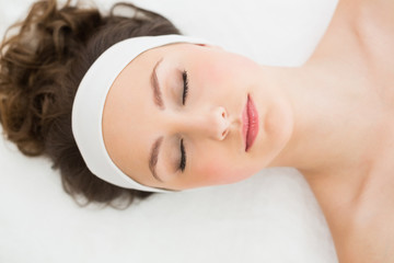 Brunette with eyes closed in beauty salon