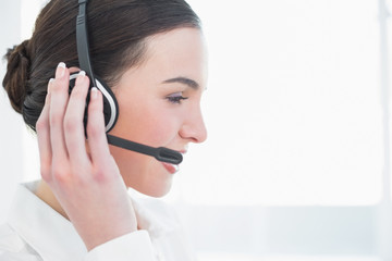 Close up side view of businesswoman wearing headset