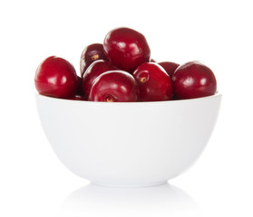 Red sweet cherries in cup