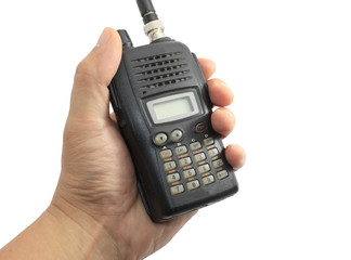 Hand holding black ham radio isolated on white