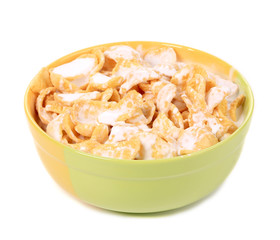 Bowl of sugar-coated corn flakes with milk.