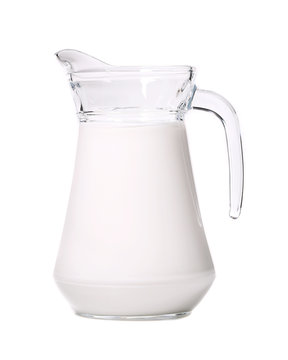 Close up of glass carafe with milk.