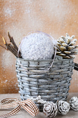 Christmas decorations in a wicker bucket