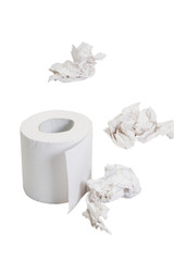 Close-up of a toilet paper roll with crumpled papers