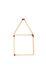 Close-up of a house shape made of matchsticks