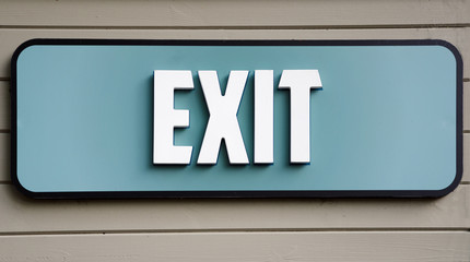 Exit sign on wooden panel