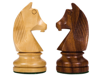 Close-up of chess knights face to face
