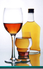 bottle and glasses with alcohol.
