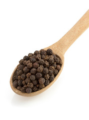 pepper in spoon on white