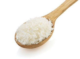 coconut chip in spoon on white