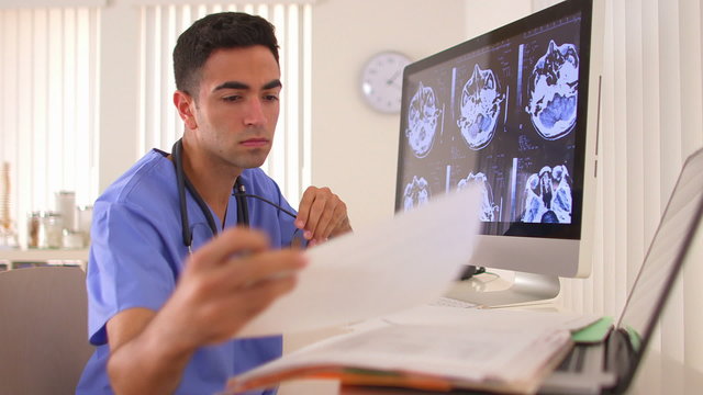 Mexican doctor analyzing brain x-rays