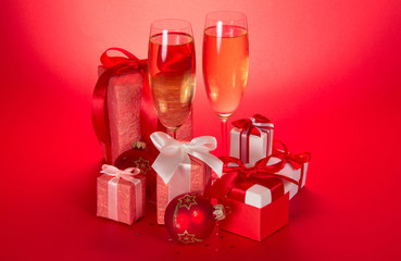Two wine glasses, gift boxes with bows
