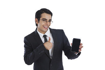 Businessman showing a mobile phone