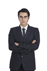 Portrait of a businessman standing with his arms crossed