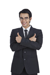 Portrait of a businessman showing thumbs up