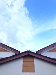 blue sky and cloud over the top of house roof