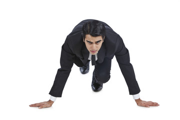 Businessman getting ready for sprint