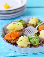 baked pork with mashed vegetables