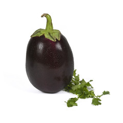 Close-up of an eggplant with parsley leaves