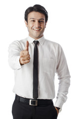 Businessman gesturing thumbs up sign
