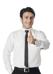 Businessman gesturing thumbs up sign
