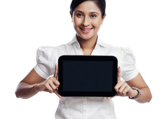 Portrait of a businesswoman showing a digital tablet and smiling