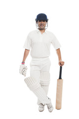 Portrait of a batsman standing with a cricket bat