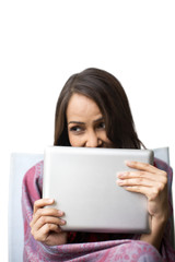Naklejka premium Close-up of a woman holding a digital tablet