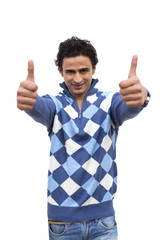 Portrait of a man showing thumbs up sign