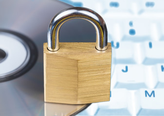Closed padlock, keyboard and DVD - data security