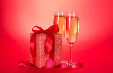 Two wine glasses and gift box with bow
