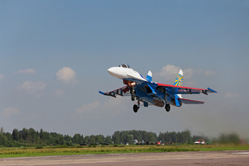 Fototapeta na wymiar Military plane taking off from the airfield