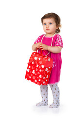 little kid with red paper bag