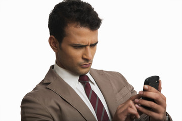 Naklejka premium Businessman using a mobile phone