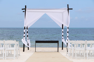 Wedding canopy and chairs on the beach