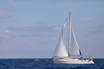 Fototapeta na wymiar Sailing boat in blue sea