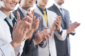 Business executives applauding