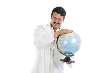 Portrait of a man holding a globe