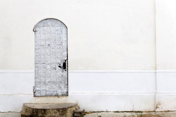 old plaster wall with a door