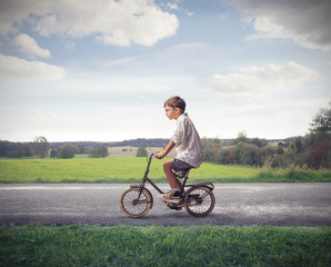 Child Cycling Forward