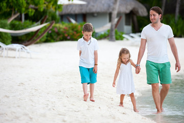 Father and kids on a beach