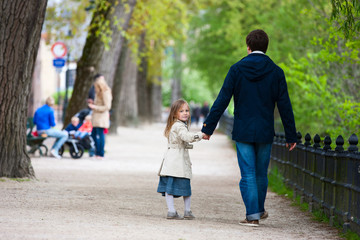 Father and daughter in city