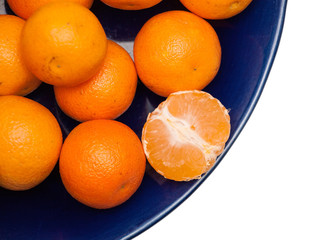 tangerines on blue plate, isolate
