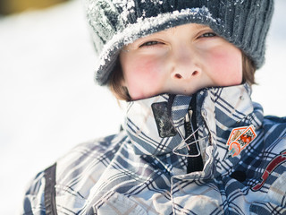 Boy playing in the snow