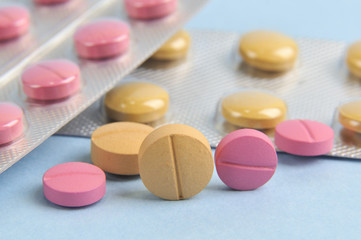 assortment of colorful pills and tablets in blister