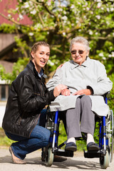 woman visiting grandmother in nursing home